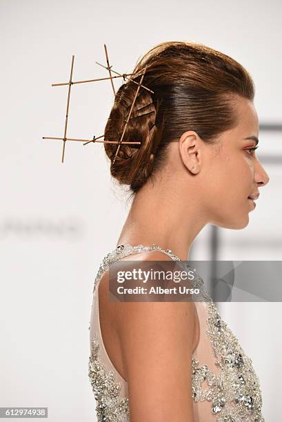 Model, hair detail, walks the runway at the Mark Zunino For Kleinfeld show during New York Fashion Week: Bridal at Kleinfeld on October 6, 2016 in...
