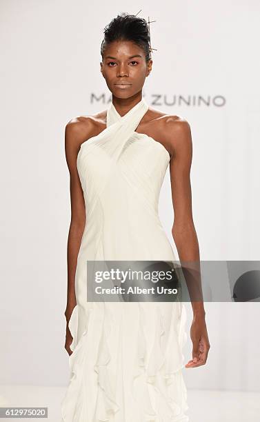 Model walks the runway at the Mark Zunino For Kleinfeld show during New York Fashion Week: Bridal at Kleinfeld on October 6, 2016 in New York City.