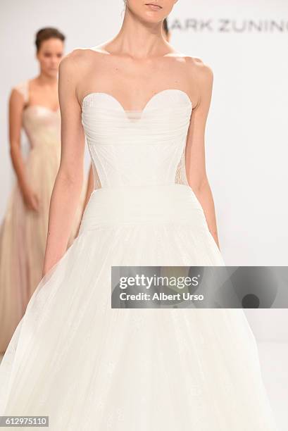 Model, dress detail, walks the runway at the Mark Zunino For Kleinfeld show during New York Fashion Week: Bridal at Kleinfeld on October 6, 2016 in...