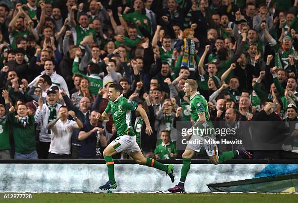 Seamus Coleman of Republic of Ireland celebrates scoring his sides first goal with team mate James McClean during the FIFA 2018 World Cup Group D...