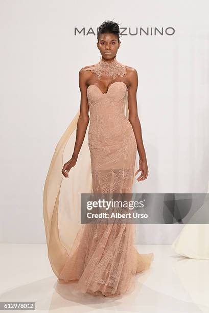 Model walks the runway at the Mark Zunino For Kleinfeld show during New York Fashion Week: Bridal at Kleinfeld on October 6, 2016 in New York City.