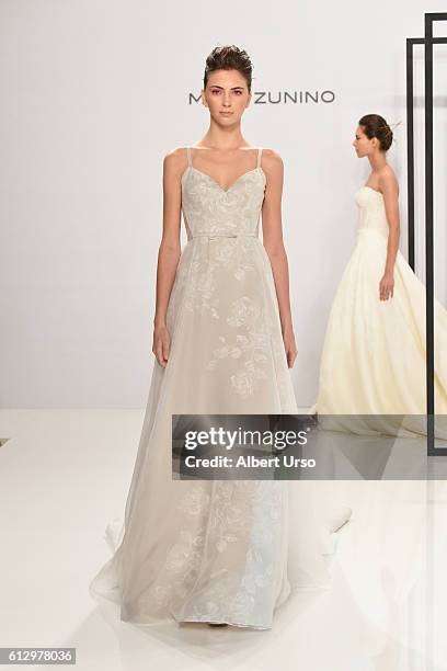 Model walks the runway at the Mark Zunino For Kleinfeld show during New York Fashion Week: Bridal at Kleinfeld on October 6, 2016 in New York City.