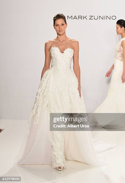 Model walks the runway at the Mark Zunino For Kleinfeld show during New York Fashion Week: Bridal at Kleinfeld on October 6, 2016 in New York City.