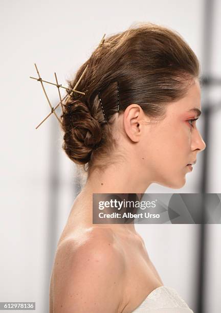 Model, hair detail, walks the runway at the Mark Zunino For Kleinfeld show during New York Fashion Week: Bridal at Kleinfeld on October 6, 2016 in...