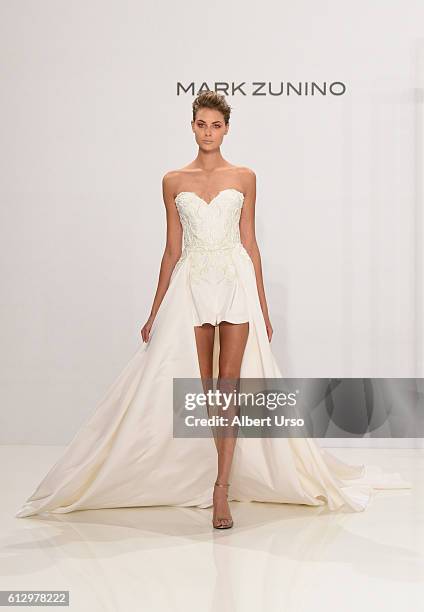 Model walks the runway at the Mark Zunino For Kleinfeld show during New York Fashion Week: Bridal at Kleinfeld on October 6, 2016 in New York City.