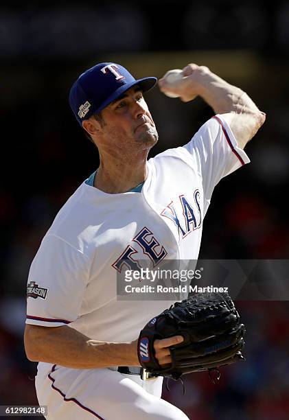 Cole Hamels of the Texas Rangers throws a pitch against the Toronto Blue Jays during the first inning in game one of the American League Divison...