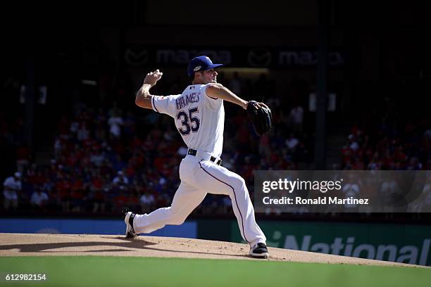 Cole Hamels of the Texas Rangers throws a pitch against the Toronto Blue Jays during the first inning in game one of the American League Divison...