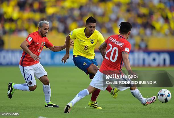 Ecuador's midfielder Christian Noboa vies for the ball with Chile's Marcelo Diaz and Chile's Charles Aranguiz during their Russia 2018 World Cup...