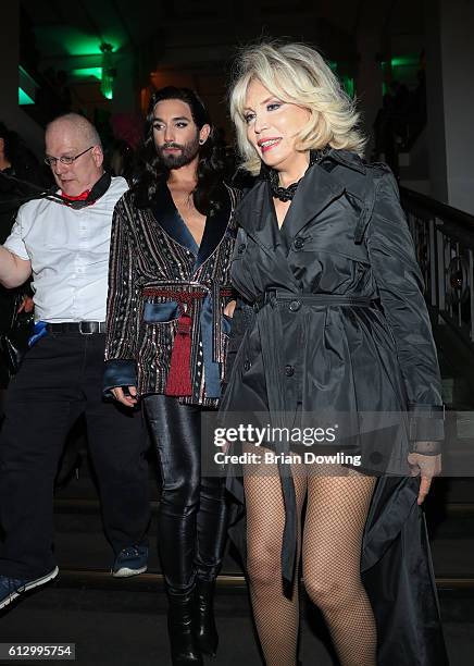 Conchita Wurst and Amanda Lear at 'THE ONE Grand Show' premiere at Friedrichstadt-Palast on October 6, 2016 in Berlin, Germany.