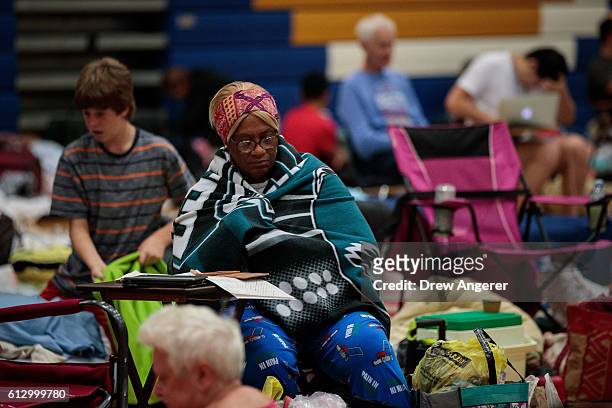 People take shelter at Mainland High School, October 6, 2016 in Jacksonville, Florida. With Hurricane Matthew approaching the Atlantic coast of the...