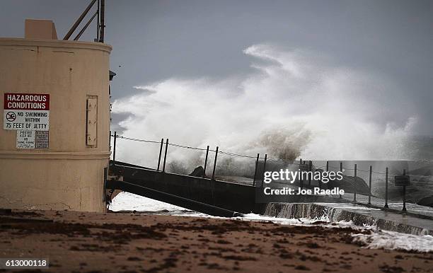 Waves crash ashore as Hurricane Matthew approaches the area on October 6, 2016 in Singer Island, Florida. The hurricane is expected to make landfall...