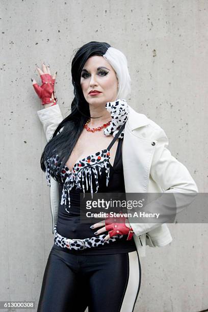 An attendee dressed as Cruella de Vil poses on the first day of 2016 New York Comic Con on October 6, 2016 in New York City.