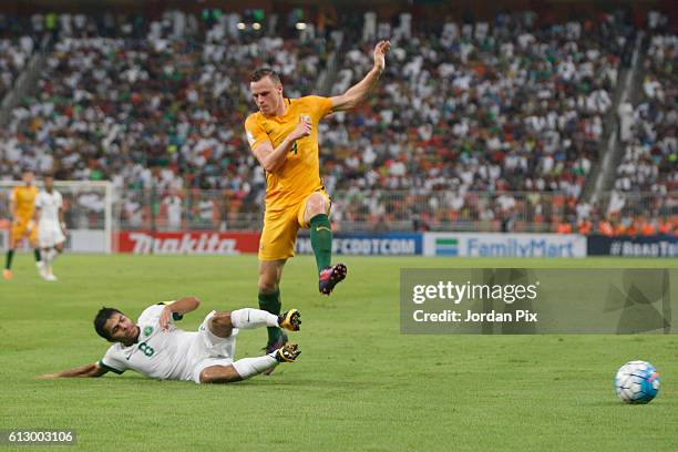 Australian player Brad Smith competes with Saudi Yahia Alshehri during the match between Saudi Arabia and Australia for the FIFA World Cup Qualifier...