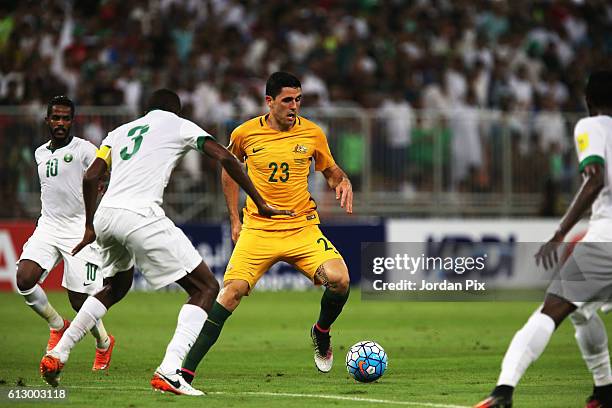 Australian player Tomas Rogic competes with Saudi players during the match between Saudi Arabia and Australia for the FIFA World Cup Qualifier Russia...