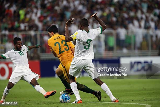 Australian player Tomas Rogic competes with Saudi players during the match between Saudi Arabia and Australia for the FIFA World Cup Qualifier Russia...