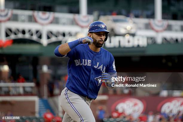 Jose Bautista of the Toronto Blue Jays celebrates after hitting a three run home run to left field against Jake Diekman of the Texas Rangers during...