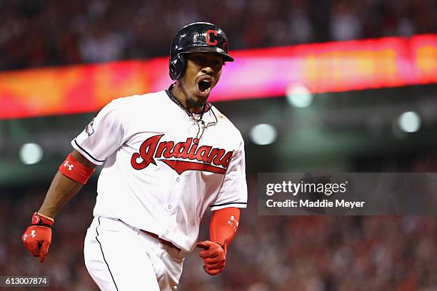 Francisco Lindor of the Cleveland Indians celebrates as he runs the bases after hitting a solo home run in the third inning against the Boston Red...