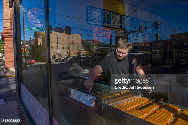 Josh Burick works at the Coney Island Hot Dog shop in Johnstown, Pennsylvania on October 6, 2016. Johnstown, Pennsylvania, with a population of...