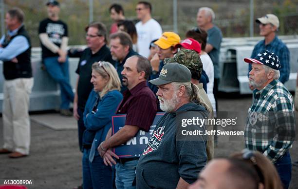 Supporters listen to Republican candidate for Vice President Mike Pence as he speaks to close to 250 supporters at a rally at JWF Industries in...