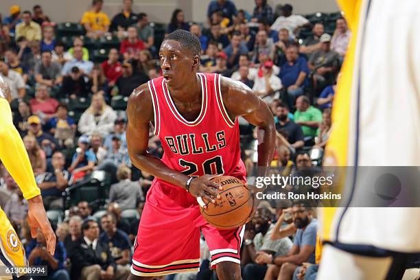 Tony Snell of the Chicago Bulls handles the ball against the Indiana Pacers during a preseason game on October 6, 2016 at Bankers Life Fieldhouse in...