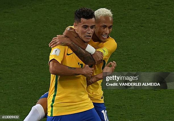 Brazil's Philippe Coutinho celebrates his goal against Bolivia with teammate Neymar during their Russia 2018 World Cup qualifier football match in...