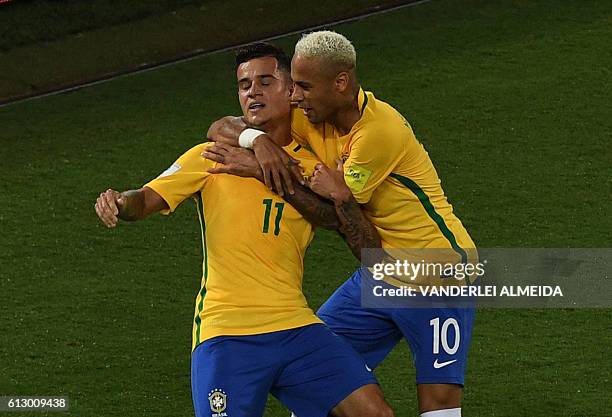 Brazil's Philippe Coutinho celebrates his goal against Bolivia with teammate Neymar during their Russia 2018 World Cup qualifier football match in...