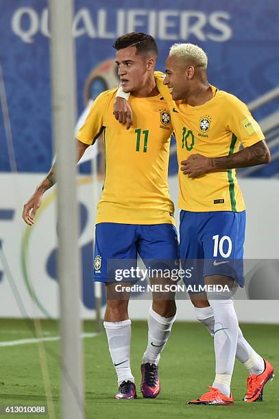 Brazil's Philippe Coutinho celebrates his goal against Bolivia with teammate Neymar during their Russia 2018 World Cup qualifier football match in...