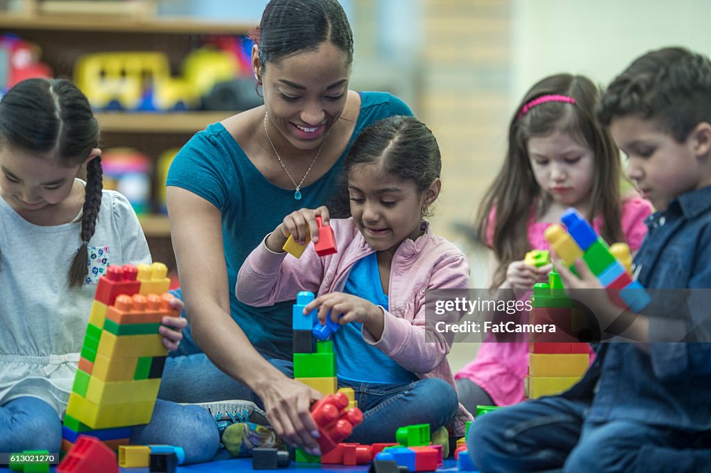 Teacher Playing with Her Students