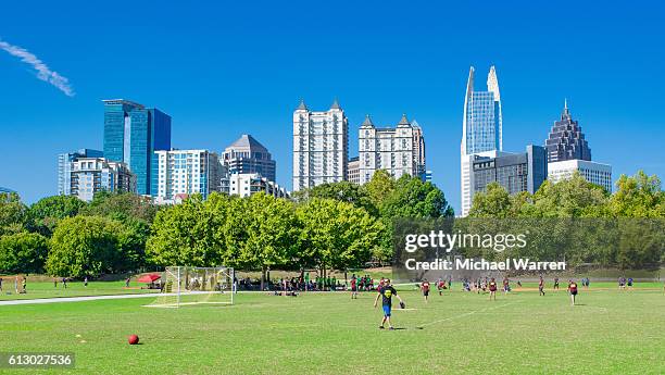 atlanta skyline and piedmont park - kickball stock pictures, royalty-free photos & images