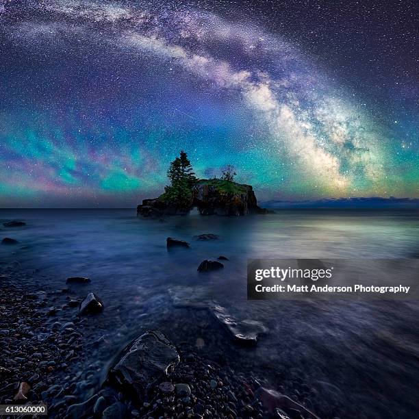 milky way over hollow rock - winter weather stock pictures, royalty-free photos & images