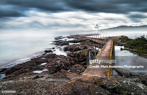 grand marais lighthouse in fog - us army reserve stock pictures, royalty-free photos & images