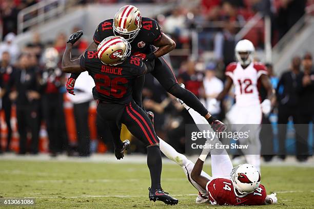 Antoine Bethea hits Tramaine Brock of the San Francisco 49ers while going after a tipped ball against the Arizona Cardinals during their NFL game at...