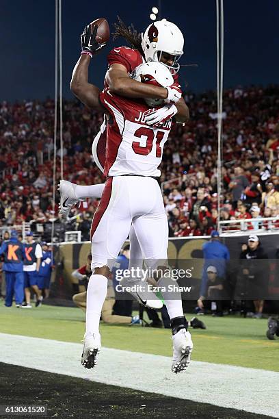 David Johnson of the Arizona Cardinals celebrates a touchdown with Larry Fitzgerald during their NFL game against the San Francisco 49ers at Levi's...