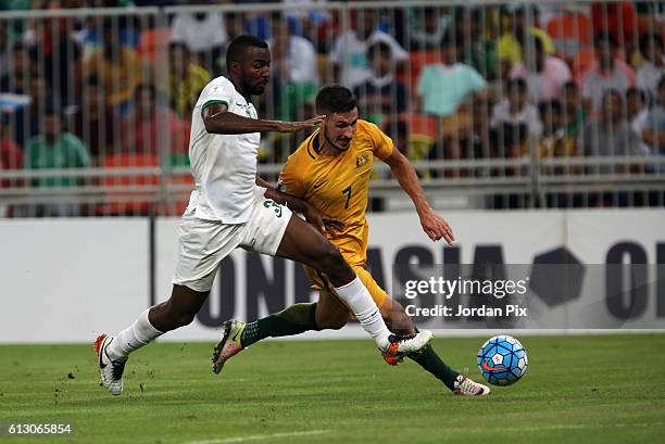 Australian player Mathew Leckie competes with a Saudi player during the match between Saudi Arabia and Australia for the FIFA World Cup Qualifier...
