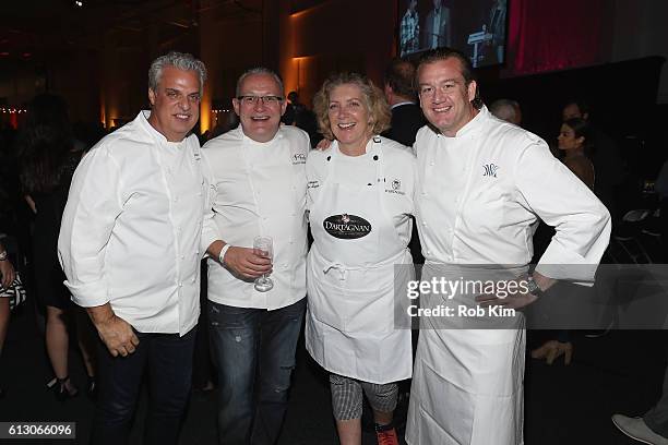 Chefs Eric Ripert, Florian Bellanger, Ariane Daguin, and Michael White attend City Harvest's 22nd Annual Bid Against Hunger at Pier 36 on October 6,...