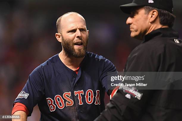 Dustin Pedroia of the Boston Red Sox reacts after striking out to end game one of the American League Divison Series against the Cleveland Indians at...