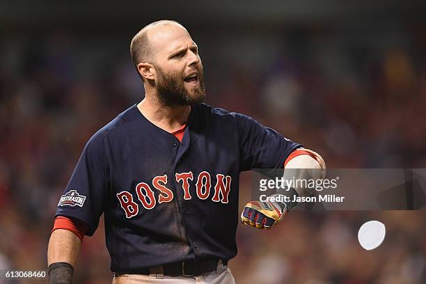 Dustin Pedroia of the Boston Red Sox reacts after striking out to end game one of the American League Divison Series against the Cleveland Indians at...