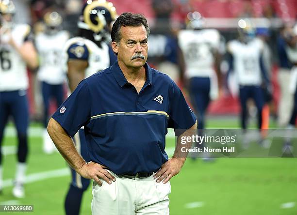 Head coach Jeff Fisher of the Los Angeles Rams watches his team warm up prior to a game against the Arizona Cardinals at University of Phoenix...