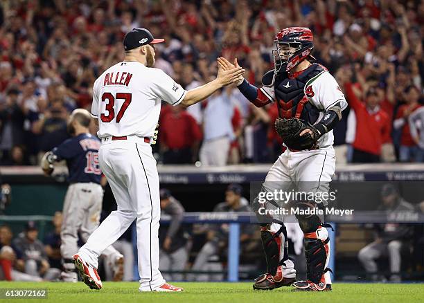 Cody Allen of the Cleveland Indians celebrates with Roberto Perez after defeating the Boston Red Sox 5-4 in game one of the American League Divison...