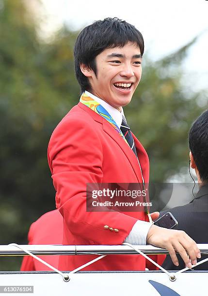 Kenzo Shirai smiles on the top of a double decker bus during the Rio Olympic Paralympic 2016 Japanese medalist parade in the ginza district on...