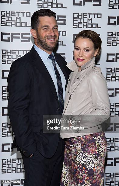 David Bugliari and Alyssa Milano attend a benefit hosted by Brian Grazer for the Ghetto Film School on October 6, 2016 in Beverly Hills, California.