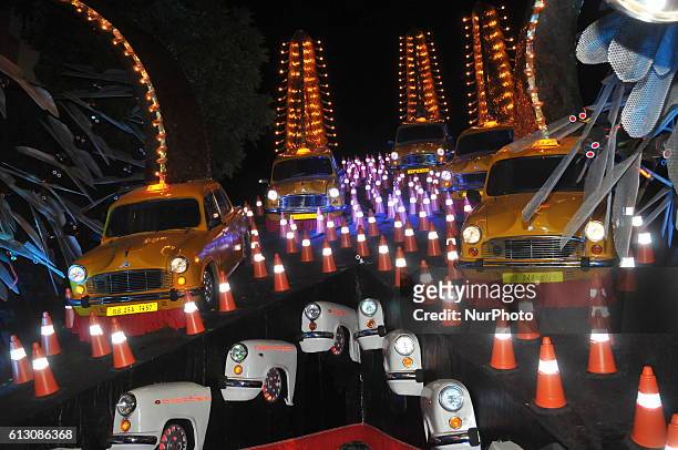India famous Ambassador Taxi is theme of 33 Pally's Sarbojanin Durga Puja Pandal of Beleghata area on October 06,2016 in Kolkata,India.The Hindustan...