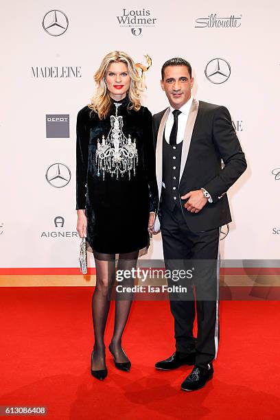 Boxer Ismail Oezen and Janina Otto attend the Tribute To Bambi at Station on October 6, 2016 in Berlin, Germany.