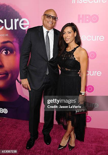 Larry Wilmore and Laura Azevedo attend the premiere of "Insecure" at Nate Holden Performing Arts Center on October 6, 2016 in Los Angeles, California.