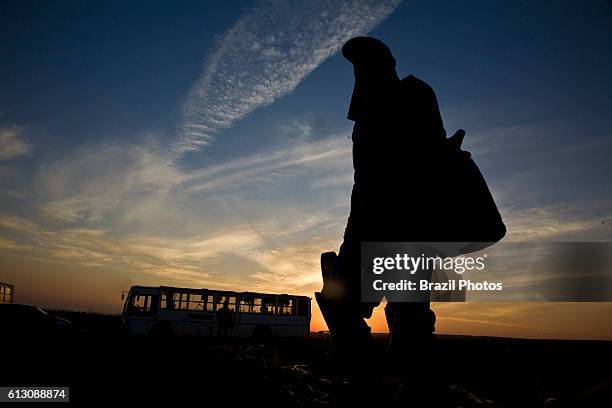 Portrait of sugarcane cutter, beggining of a new day of work, temporary agricultural laborer, production of Brazilian ethanol. Cosmopolis city...