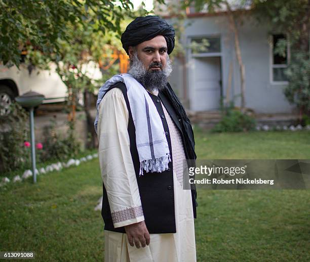 Former Taliban finance minister and advisor to Mullah Omar, Sayed Abdul Wasi Motasim Agha, 45 years, stands in a garden at a residence in an...