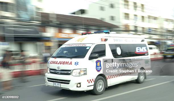 An ambulance speeds off near the clock tower at the site of the second explosions in Hua Hin, Thailand 12 hours after the first. A series of...