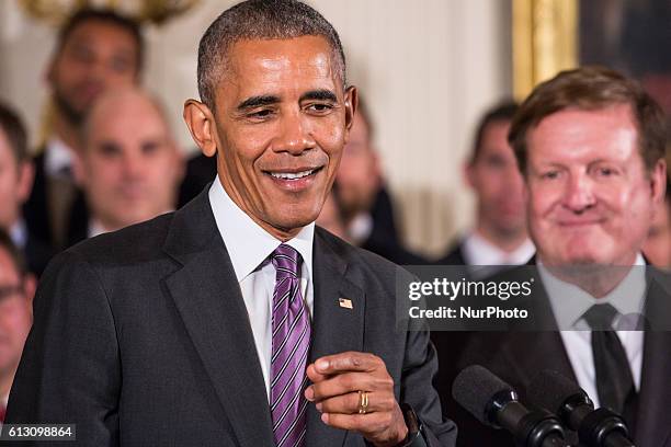 On Thursday, Oct. 6, in the East Room of the White House, President Barack Obama, with right, Pittsburgh Penguins Co-owner, Ron Burkle, welcomed the...