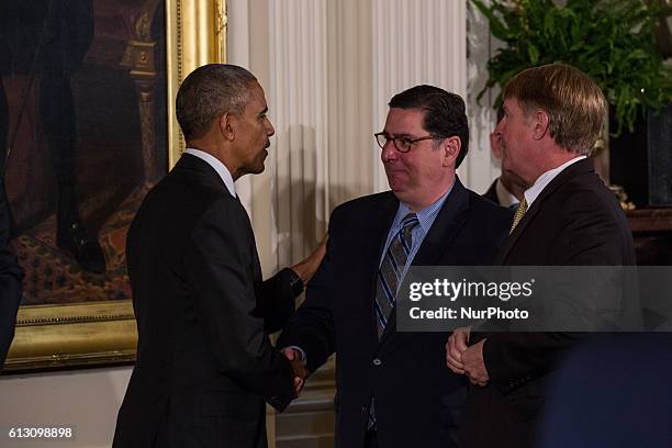 On Thursday, Oct. 6, in the East Room of the White House, President Barack Obama stops to say hi to Bill Peduto, Mayor of Pittsburgh, before leaving...