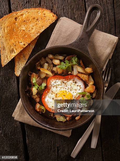 eggs fried in peppers with hash browns - continental breakfast stock pictures, royalty-free photos & images